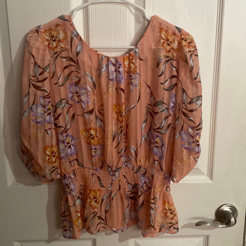 cream color blouse, stitching on both side of the arm sides. Size M but fits S